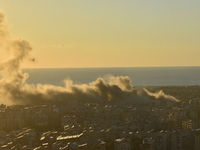 Black smoke billows from Beirut's southern suburb following heavy Israeli air raids on the pro-Iranian Hezbollah stronghold in Beirut, Leban...