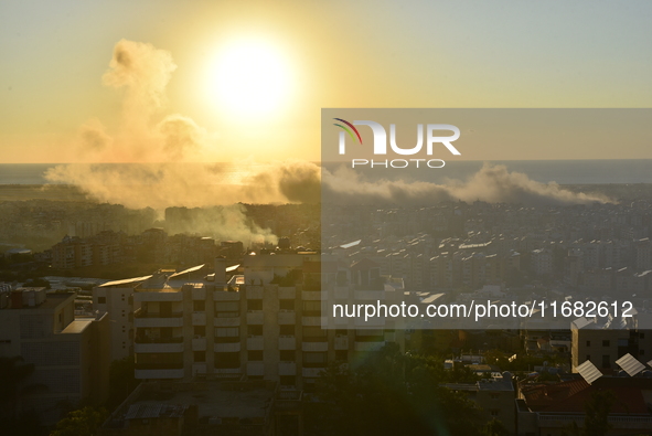 Black smoke billows from Beirut's southern suburb following heavy Israeli air raids on the pro-Iranian Hezbollah stronghold in Beirut, Leban...