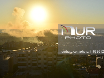 Black smoke billows from Beirut's southern suburb following heavy Israeli air raids on the pro-Iranian Hezbollah stronghold in Beirut, Leban...