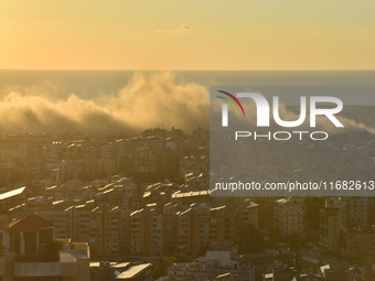 Black smoke billows from Beirut's southern suburb following heavy Israeli air raids on the pro-Iranian Hezbollah stronghold in Beirut, Leban...