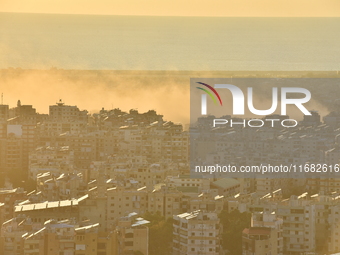 Black smoke billows from Beirut's southern suburb following heavy Israeli air raids on the pro-Iranian Hezbollah stronghold in Beirut, Leban...