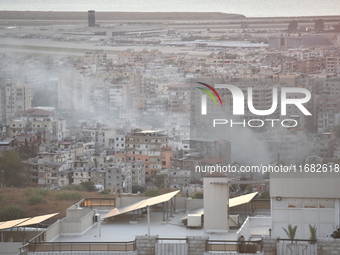 Black smoke billows from Beirut's southern suburb following heavy Israeli air raids on the pro-Iranian Hezbollah stronghold in Beirut, Leban...