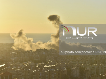 Black smoke billows from Beirut's southern suburb following heavy Israeli air raids on the pro-Iranian Hezbollah stronghold in Beirut, Leban...