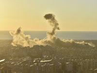 Black smoke billows from Beirut's southern suburb following heavy Israeli air raids on the pro-Iranian Hezbollah stronghold in Beirut, Leban...