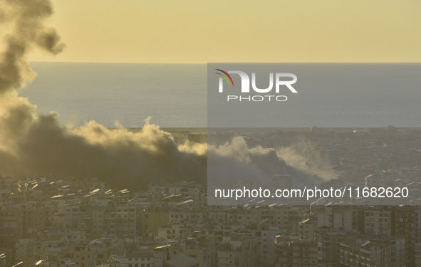 Black smoke billows from Beirut's southern suburb following heavy Israeli air raids on the pro-Iranian Hezbollah stronghold in Beirut, Leban...