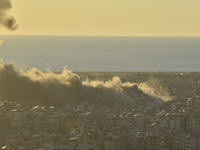 Black smoke billows from Beirut's southern suburb following heavy Israeli air raids on the pro-Iranian Hezbollah stronghold in Beirut, Leban...