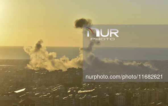 Black smoke billows from Beirut's southern suburb following heavy Israeli air raids on the pro-Iranian Hezbollah stronghold in Beirut, Leban...