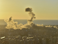 Black smoke billows from Beirut's southern suburb following heavy Israeli air raids on the pro-Iranian Hezbollah stronghold in Beirut, Leban...