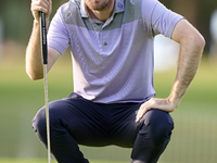 Andrew Wilson of England studies his shot on the 1st green on the third day of the Estrella Damm N.A. Andalucia Masters 2024 at Real Club de...