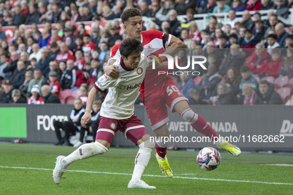 Middlesbrough's Neto Borges challenges for the ball with Bristol City's Yu Hirakawa during the Sky Bet Championship match between Middlesbro...