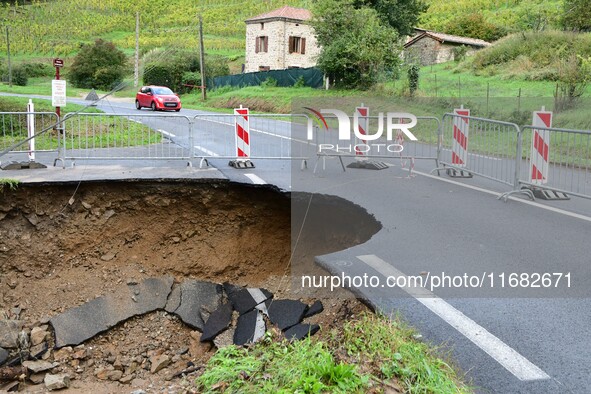 A collapsed road after flooding in the Rhone Valley in the village of Lupe, Loire department, on October 19, 2024. 