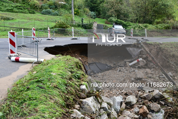 A collapsed road after flooding in the Rhone Valley in the village of Lupe, Loire department, on October 19, 2024. 