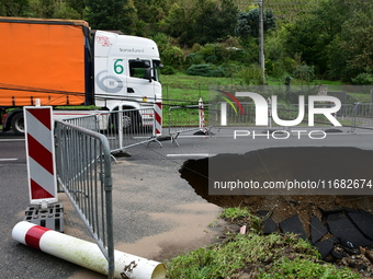 A collapsed road after flooding in the Rhone Valley in the village of Lupe, Loire department, on October 19, 2024. (