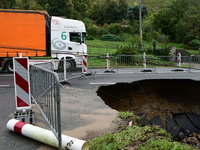 A collapsed road after flooding in the Rhone Valley in the village of Lupe, Loire department, on October 19, 2024. (