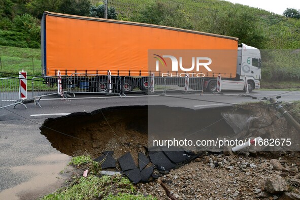 A collapsed road after flooding in the Rhone Valley in the village of Lupe, Loire department, on October 19, 2024. 