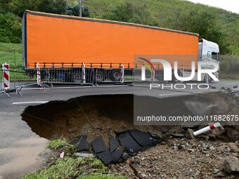 A collapsed road after flooding in the Rhone Valley in the village of Lupe, Loire department, on October 19, 2024. (