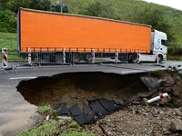 A collapsed road after flooding in the Rhone Valley in the village of Lupe, Loire department, on October 19, 2024. (