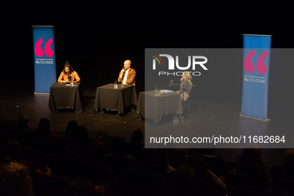 Matt Haig, the English author, Alice Hasters, a German journalist, and Annette Frier, a German actress, are seen on the stage of Schauspiel...