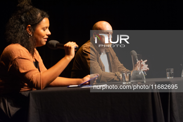 Matt Haig, the English author, and Alice Hasters, a German journalist, are seen on the stage of Schauspiel Koeln depot in Cologne, Germany,...