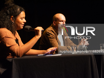 Matt Haig, the English author, and Alice Hasters, a German journalist, are seen on the stage of Schauspiel Koeln depot in Cologne, Germany,...