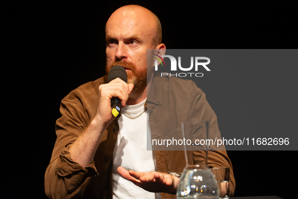 Matt Haig, the English author, appears on the stage of Schauspiel Koeln depot in Cologne, Germany, on October 19, 2024, during the Cologne l...