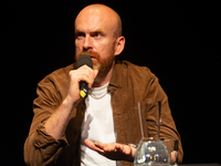 Matt Haig, the English author, appears on the stage of Schauspiel Koeln depot in Cologne, Germany, on October 19, 2024, during the Cologne l...