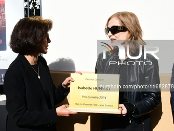 Rachida Dati, Minister of Culture, and Isabelle Huppert attend the remake of the light factories in Lyon, France, on October 19, 2024. (