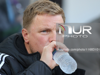 Newcastle United Manager Eddie Howe drinks from a bottle of water during the Premier League match between Newcastle United and Brighton and...