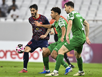 Luis Alberto of Al Duhail FC battles for the ball with Matej Mitrovic of Al Ahli SC during the Ooredoo Qatar Stars League 24/25 match betwee...