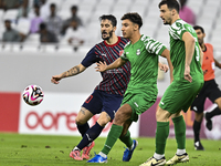 Luis Alberto of Al Duhail FC battles for the ball with Matej Mitrovic of Al Ahli SC during the Ooredoo Qatar Stars League 24/25 match betwee...