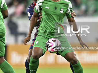 Ahmed Mohamed Elsayed of Al Duhail FC battles for the ball with Sekou Oumar Yansane of Al Ahli SC during the Ooredoo Qatar Stars League 24/2...