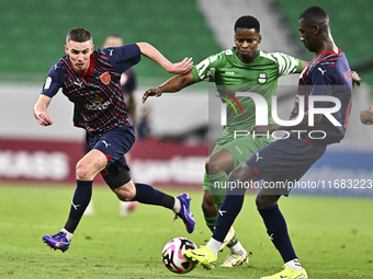 Benjamin Bourigeaud of Al Duhail FC battles for the ball with Idrissa Doumbin of Al Ahli SC during the Ooredoo Qatar Stars League 24/25 matc...