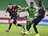 Benjamin Bourigeaud of Al Duhail FC battles for the ball with Idrissa Doumbin of Al Ahli SC during the Ooredoo Qatar Stars League 24/25 matc...