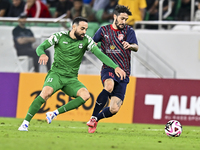 Luis Alberto of Al Duhail FC battles for the ball with Driss Fettouhi of Al Ahli SC during the Ooredoo Qatar Stars League 24/25 match betwee...