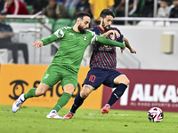 Luis Alberto of Al Duhail FC battles for the ball with Driss Fettouhi of Al Ahli SC during the Ooredoo Qatar Stars League 24/25 match betwee...