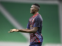 Michael Olunga (R) of Al Duhail FC celebrates after scoring a goal during the Ooredoo Qatar Stars League 24/25 match between Al Ahli SC and...