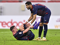 Sultan Al-Brake (right) and Benjamin Bourigeaud (left) of Al Duhail FC react during the Ooredoo Qatar Stars League 24/25 match between Al Ah...