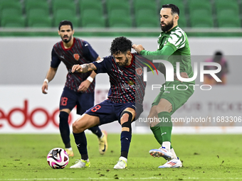 Edmilson Junior Paulo of Al Duhail FC battles for the ball with Driss Fettouhi of Al Ahli SC during the Ooredoo Qatar Stars League 24/25 mat...