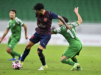 Edmilson Junior Paulo of Al Duhail FC battles for the ball with Abdelrhman Mohamed Moustafa of Al Ahli SC during the Ooredoo Qatar Stars Lea...