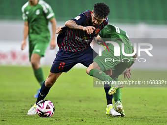 Edmilson Junior Paulo of Al Duhail FC battles for the ball with Abdelrhman Mohamed Moustafa of Al Ahli SC during the Ooredoo Qatar Stars Lea...