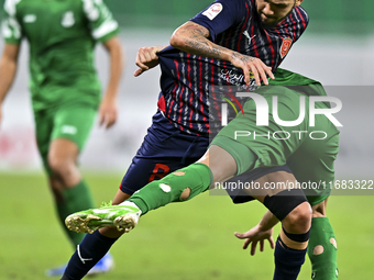 Edmilson Junior Paulo of Al Duhail FC battles for the ball with Abdelrhman Mohamed Moustafa of Al Ahli SC during the Ooredoo Qatar Stars Lea...