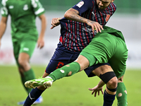 Edmilson Junior Paulo of Al Duhail FC battles for the ball with Abdelrhman Mohamed Moustafa of Al Ahli SC during the Ooredoo Qatar Stars Lea...