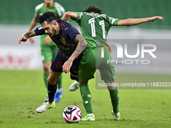 Edmilson Junior Paulo of Al Duhail FC battles for the ball with Abdelrhman Mohamed Moustafa of Al Ahli SC during the Ooredoo Qatar Stars Lea...