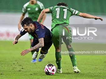 Edmilson Junior Paulo of Al Duhail FC battles for the ball with Abdelrhman Mohamed Moustafa of Al Ahli SC during the Ooredoo Qatar Stars Lea...