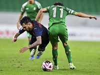 Edmilson Junior Paulo of Al Duhail FC battles for the ball with Abdelrhman Mohamed Moustafa of Al Ahli SC during the Ooredoo Qatar Stars Lea...