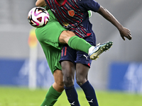 Almoez Abdulla (R) of Al Duhail FC battles for the ball with Talal Abdulla Bahzad of Al Ahli SC during the Ooredoo Qatar Stars League 24/25...