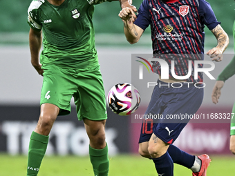 Luis Alberto of Al Duhail FC battles for the ball with Talal Abdulla Bahzad of Al Ahli SC during the Ooredoo Qatar Stars League 24/25 match...