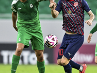 Luis Alberto of Al Duhail FC battles for the ball with Talal Abdulla Bahzad of Al Ahli SC during the Ooredoo Qatar Stars League 24/25 match...