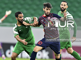 Luis Alberto (R) of Al Duhail FC battles for the ball with Talal Abdulla Bahzad of Al Ahli SC during the Ooredoo Qatar Stars League 24/25 ma...