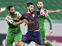 Luis Alberto (R) of Al Duhail FC battles for the ball with Talal Abdulla Bahzad of Al Ahli SC during the Ooredoo Qatar Stars League 24/25 ma...